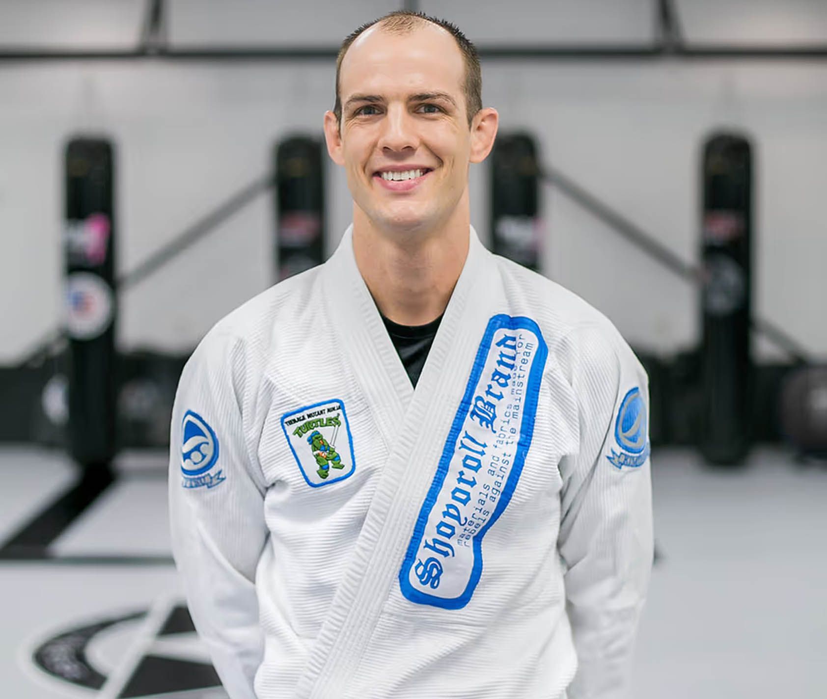 Coaches working pads at Miller Martial Arts